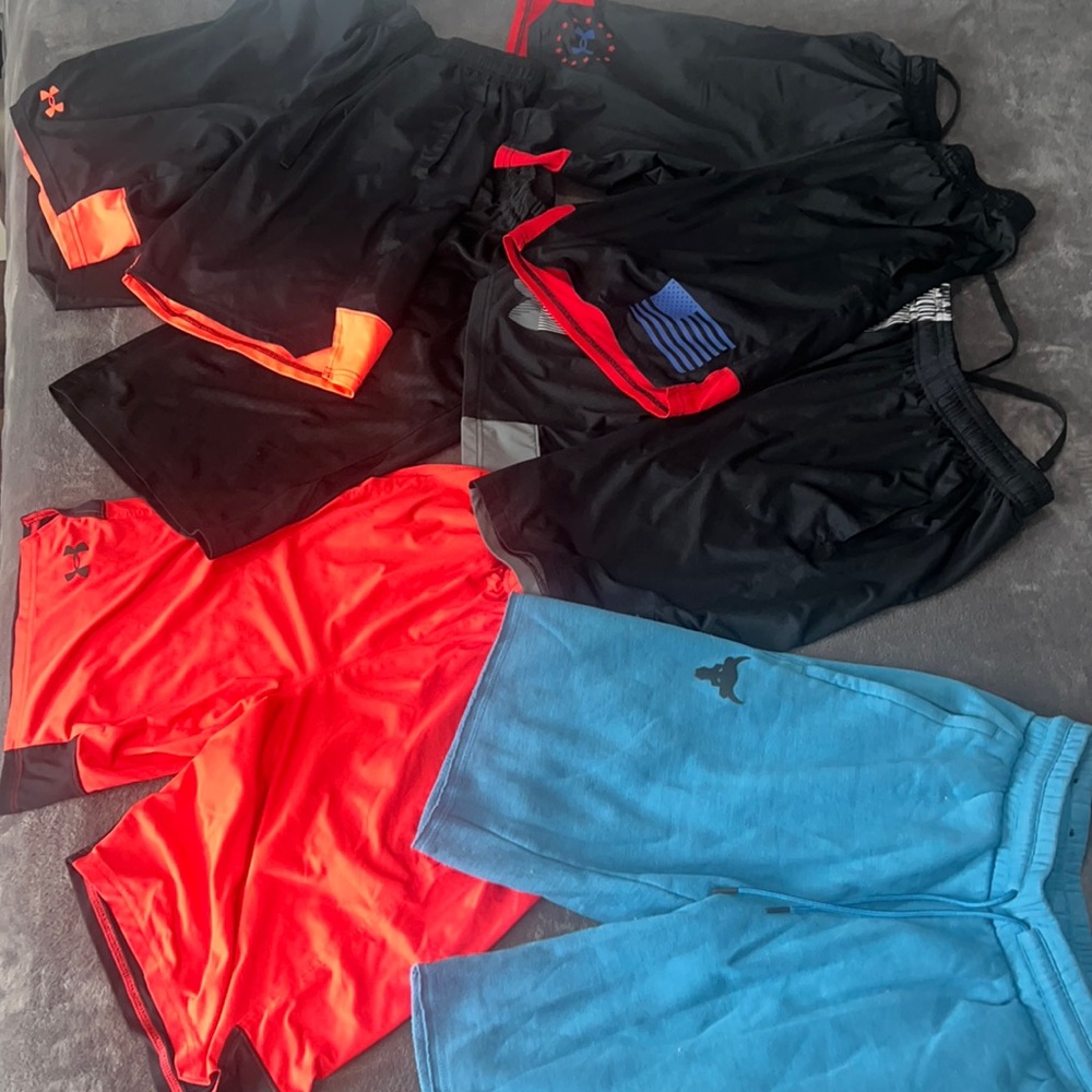 Six pair of men’s size small, athletic shorts. Under armor and Nike.